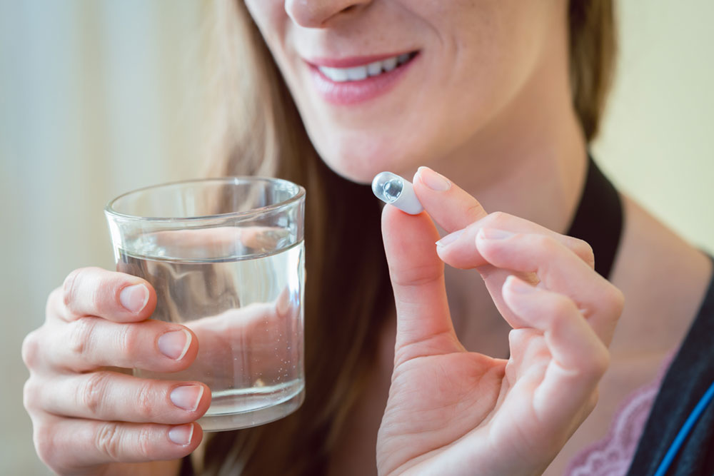 woman-with-capsule